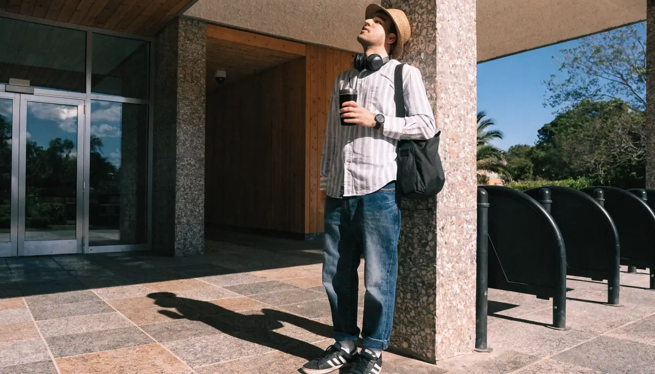 Adult man looking up under harsh midday sun